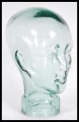 A vintage retro 20th century shop display / millinery mannequin head of pressed glass construction