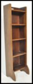 A 19th century Liberty & Co of London open window upright pedestal bookcase. The central shelves