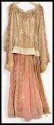 An early 20th Century revival of a dress from the middle ages, the dress with rabbit fur collar,