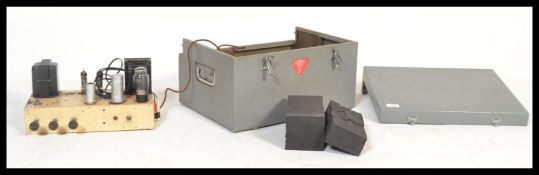 A 20th Century vintage retro valve amplifier set within a hard carry case with twin handles.