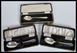 A group of three boxed Christening spoons to include a pair of Adole Scott Birmingham 1961 and