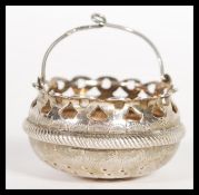A hallmarked Russian 875 silver tea strainer in the form of a basket having stamped 84 mark.