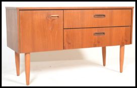 A vintage retro 20th Century teak wood low sideboard credenza of small proportions having an