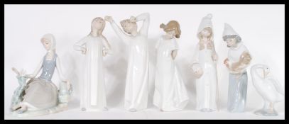 A collection of Lladro ceramic figurines to include model numbers 4870, 4678, 4872, 4677, 4660,