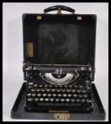 A vintage early 20th Century circa 1930's Underwood universal portable reporters typewriter, in