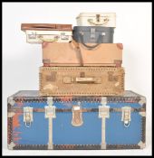 A collection of vintage retro 20th Century luggage to include a large blue and metal bound steamer