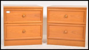 A pair of matching retro 20th Century circa 1980's G Plan teak wood bedside cabinets, two straight