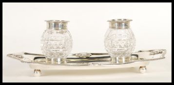 A 19th Century Victorian hallmarked silver ink stand by William Hutton & Sons having two cut cut
