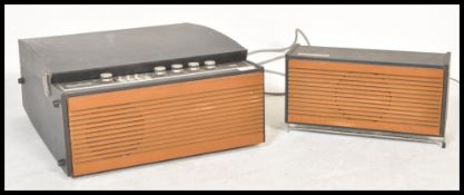 A vintage 20th Century Circa 1960's Deccalian portable record player with inset four speed Garrard