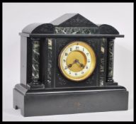 A Victorian 19th century marble and slate mantel clock having inset 8 day movement with markings for