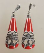 A pair of sterling silver Art Deco style drop earrings having marcasite and red enamel set drops.