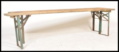 A pair of late 20th century continental retro vintage brewery festival folding benches having