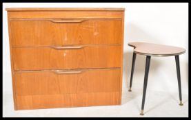 A retro 20th Century teak wood chest of three straight drawers together with a kidney shaped