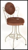 A retro vintage 20th century bedroom boudoir wire work dressing table chair having a scroll work