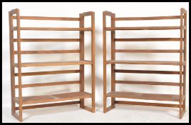 A pair of vintage early 20th Century beech wooden folding bookcases / traders display shelves. Three