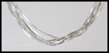 A stamped 925 silver necklace having multiple snake chains with a spring ring clasp. Total weight