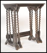 A set of early 20th Century Edwardian oak nest of three graduating side tables, solid frieze tops