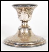 A early 20th century silver hallmarked stub filled candlestick. Birmingham assay mark dating to 1910