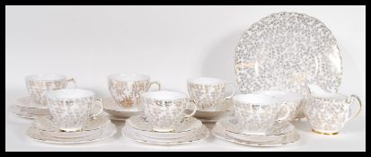 A vintage 20th Century Crown Regent part tea service having a white ground with gilt floral