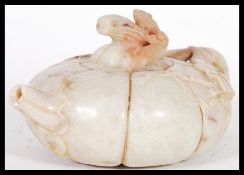 A Chinese carved soapstone teapot, the body modelled as a squash caved leaves and vine forming the