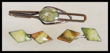 A set of vintage silver 1930's cufflinks set with green marble panels along with a matching tie clip