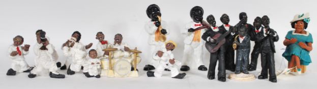 A collection of composite figures of negro jazz musicians to include singers and band members