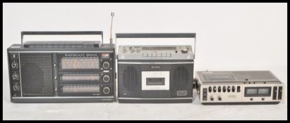 A collection of three vintage radios to include a Grundig Satellite 2100, Sony CF-550A and a Sony