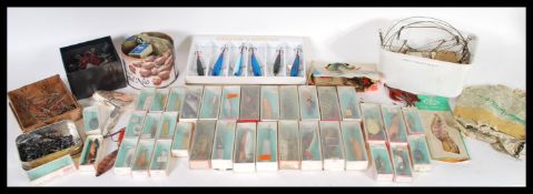 A large collection of 20th Century fishing lures, nearly all retaining original boxes and many