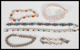A selection of stamped 925 silver bracelets to include a mother of pearl spacer bracelet, a