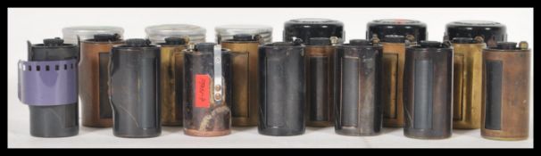 A collection of photographic Leica Leitz Wetzlar reloadable film cassettes, most in containers, 13