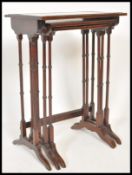 A pair of 19th Century Victorian mahogany nest of three tables having boxwood inlay decoration