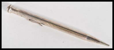 An early 20th Century sterling silver large sized Life Long propelling pencil having engine turned