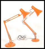 A vintage mid century Herbert Terry Industrial anglepoise desk lamp in an orange colourway