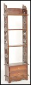 A 19th Century Victorian mahogany whatnot bookcase having a set of four shelves over twin drawer