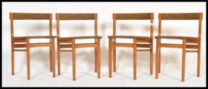 A set of four vintage retro 20th Century teak wedge chairs in the manner of G-Plan raised on four