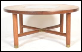 A vintage retro 20th century teak wood G-Plan Astral coffee table of circular form with inset
