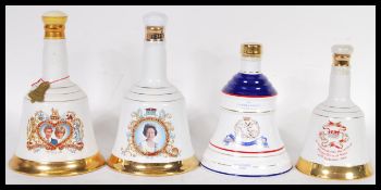 A selection of vintage Bell's whisky decanters to include a Princess Beatrice 1988 decanter, Charles
