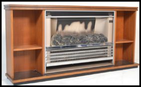 A vintage retro mid 20th Century teak wood firepla