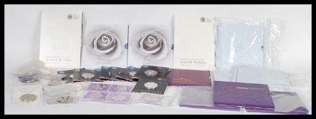 A collection of commemorative £5 coins, all sealed and uncirculated with an approximate face value