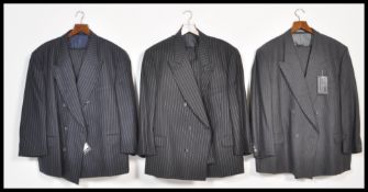 Three vintage 20th Century designer pin striped Saville Row suits by Oscar Jacobsen, all being