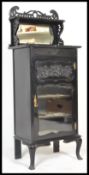 A 19th Century Victorian ebonised mahogany Art Nouveau music cabinet of pedestal form with upright