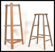 A 19th century oak Liberty of London manner torchere / plant stand table. Of tapering form with