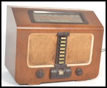 A vintage mid 20th Century 1950's oak cased HMV His Master's Voice radiogram radio having bakelite