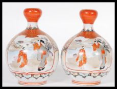 A pair of 19th century Japanese Oriental Kutani baluster vases with waisted necks having geometric
