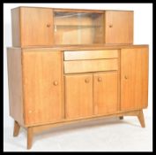 A vintage mid 20th Century NAthan teak wood sideboard credenza, having a configuration of