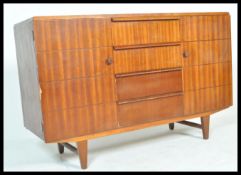 A mid century retro Danish influenced CC41 committee sideboard. Raised on tapered legs with a series