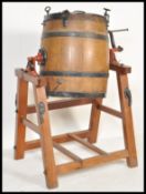 An early 20th century staved oak and metal bound butter churn, Believed Hathaway makers, Chippenham,