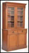 A 19th Century Victorian mahogany library bookcase, cabinet. The top half with moulded cornice above