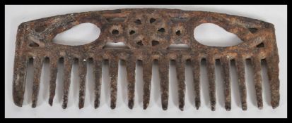 A rare antique 18th Century Georgian wrought iron horse grooming comb having central wheel