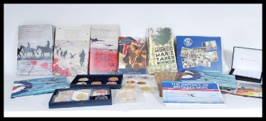 A large collection of contemporary commemorative coins and sets to include mostly Military related